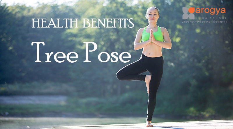 Slim female with raised arms performing Vrikshasana pose on yoga mat under  light sky in sunny town stock photo